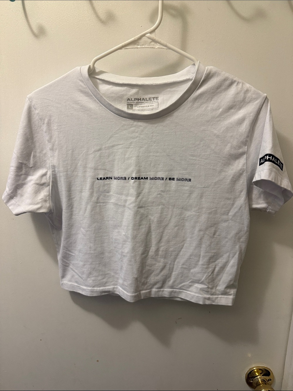 Alphalete White Cropped Tee with Center Text and Sleeve Logo